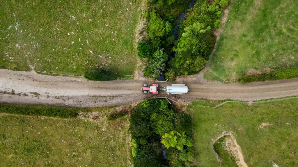 5 Advantages of Farm Tankers for NZ Dairy Farmers 3 Nevada 12800L Tandem Slurry Tanker showing easy manouverability through a narrow bridge, smart dairy farming