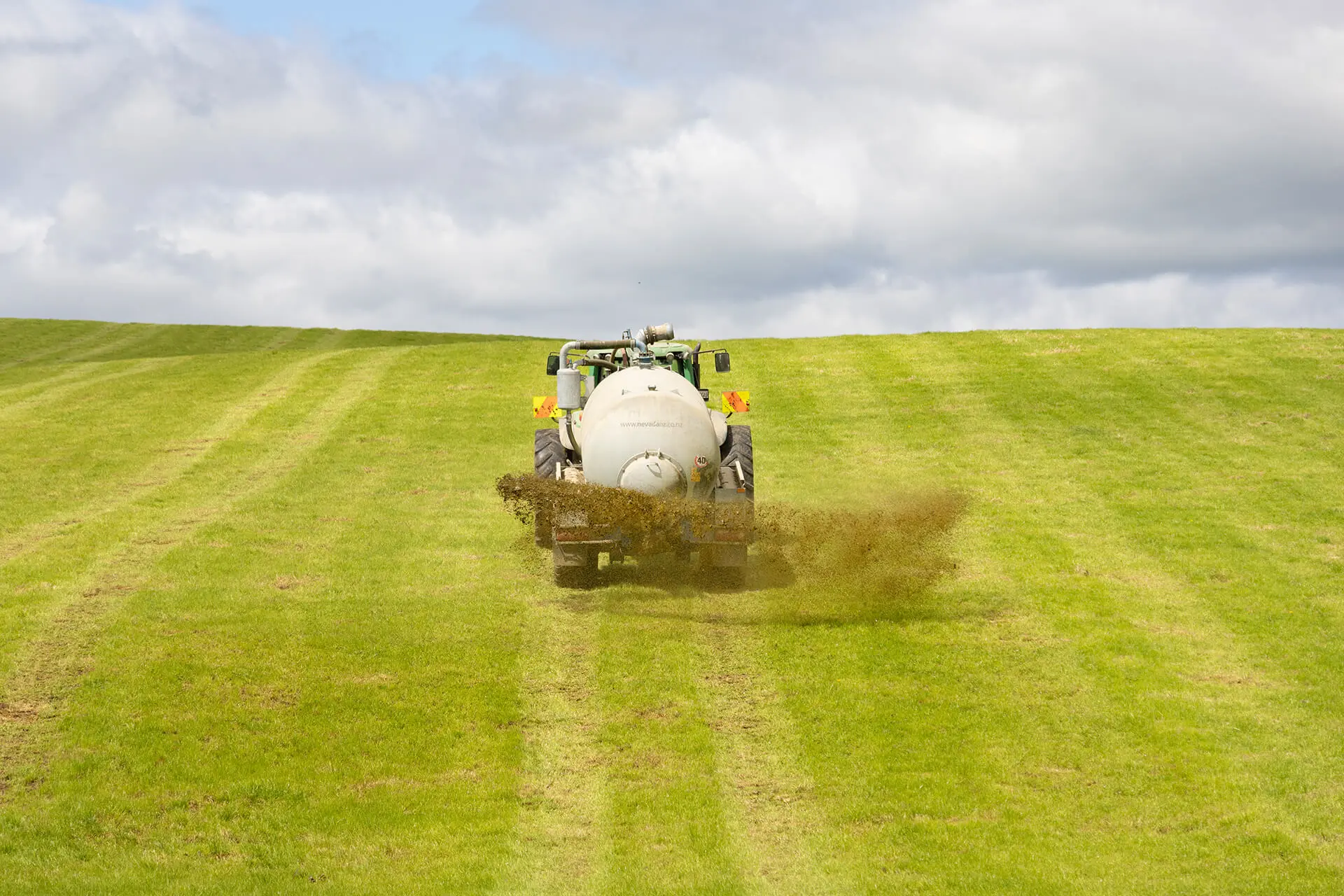 Nevada 12800L Tandem Slurry Tanker spreading with RainWave