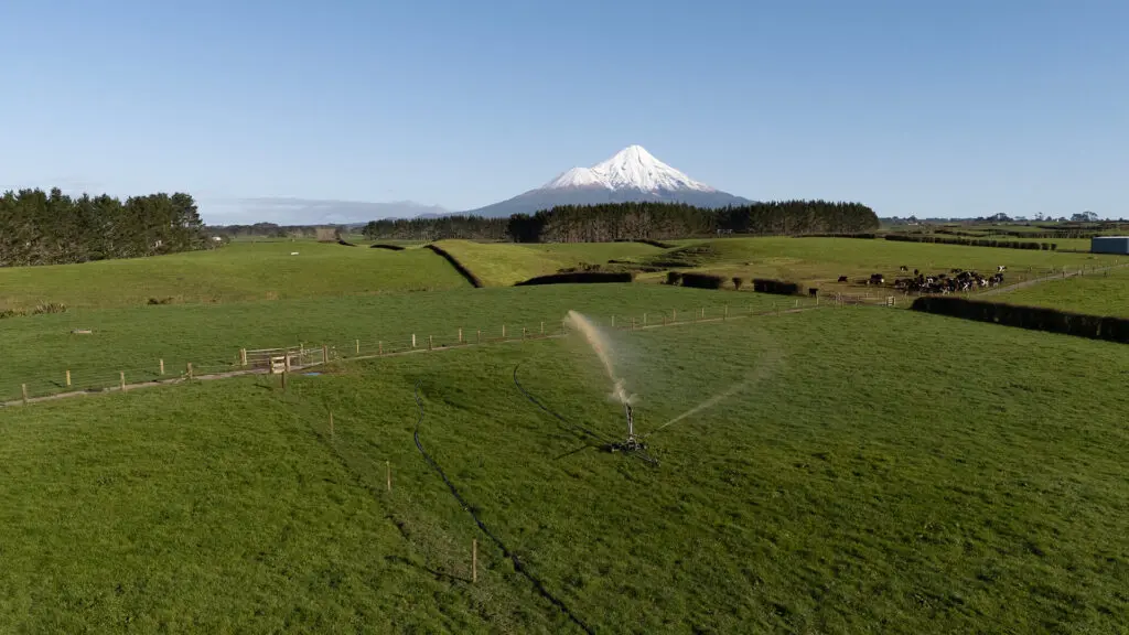 What is An Effluent Pump Used For? A Farmer's Guide 6 Greenback Magnum Irrigator, in action on a farm with Taranaki in the back ground
