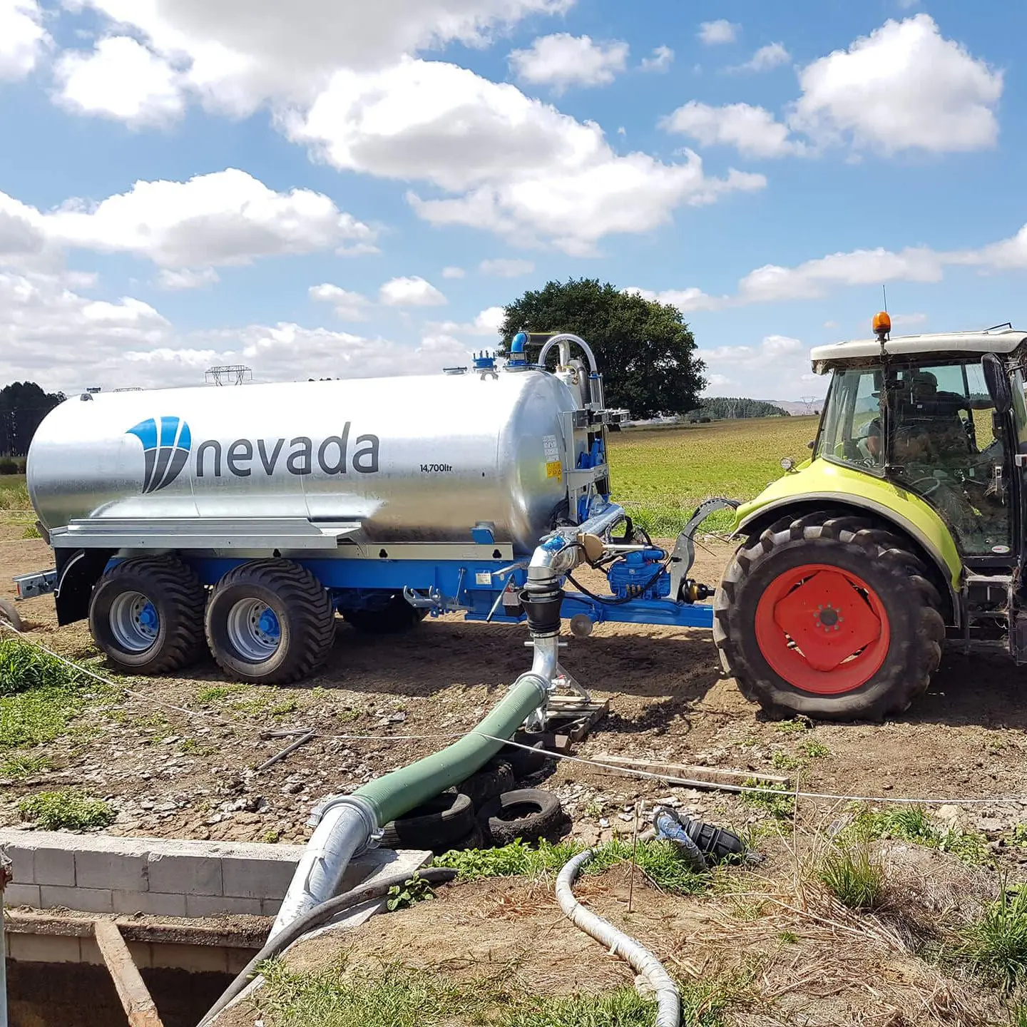 Slurry Tankers: Why a Full Chassis is Essential 2 Nevada 14700L Tandem Slurry Tanker with a full chassis exctracting effluent