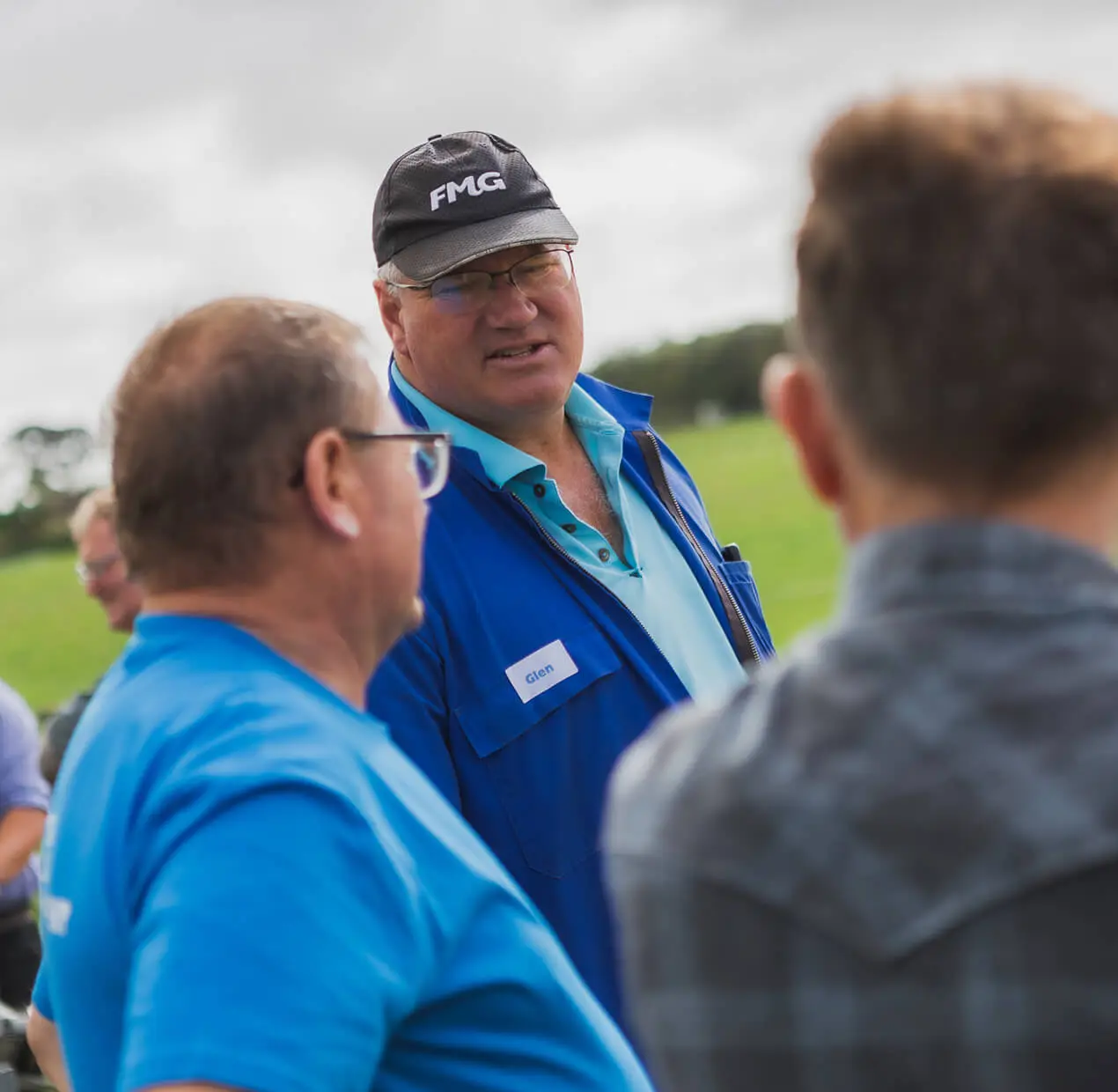 Lloyd chatting with dairy farmers