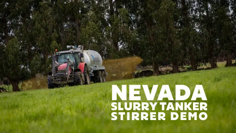Tractor towing a Nevada slurry tanker while spreading dairy effluent at Todd Dairies in Winton, Southland