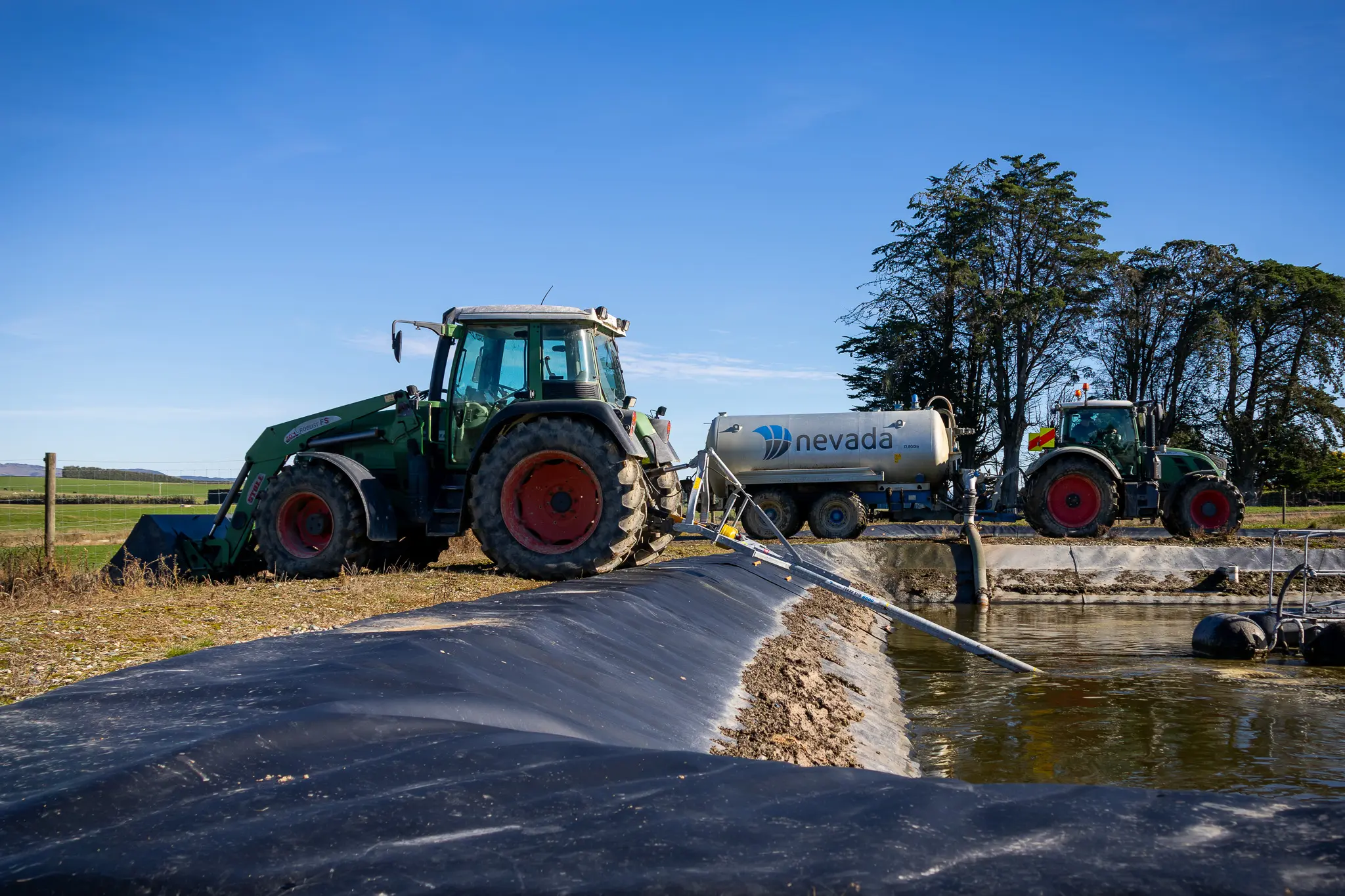 Ben and Mackenzie Two Seasons On. Slurry Tanker and PTO Stirrer Stirring and loading effluent ready for spreading.