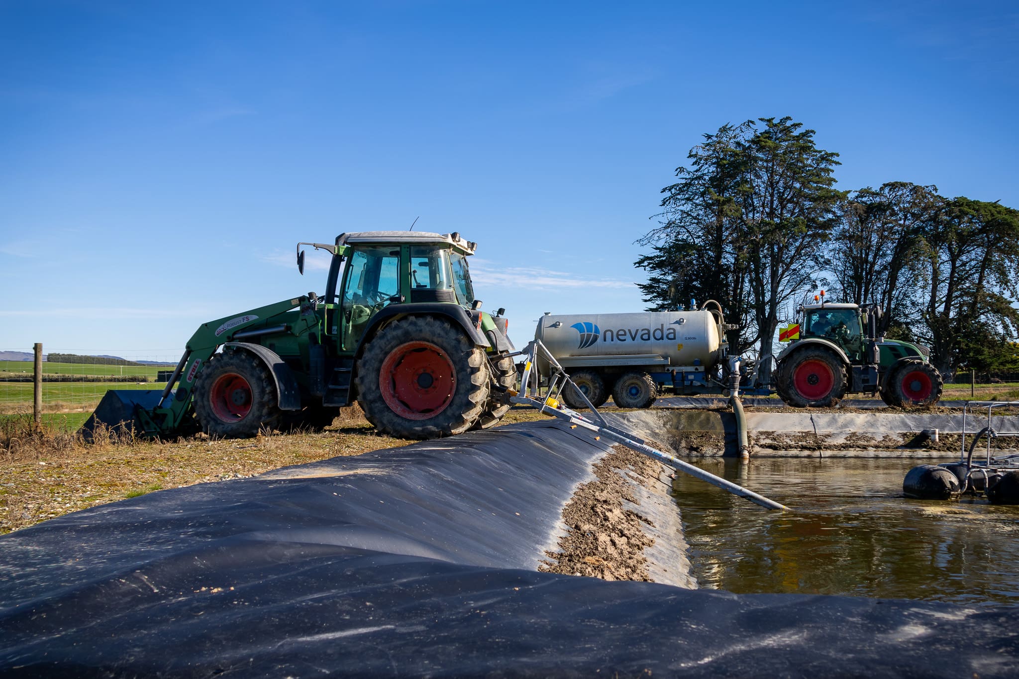 Ben and Mackenzie Two Seasons On. Slurry Tanker and PTO Stirrer Stirring and loading effluent ready for spreading.